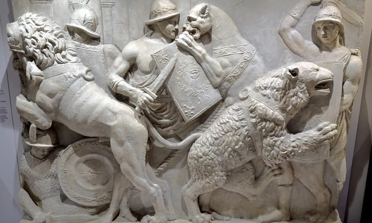 Obra retrata gladiadores em combate com animais selvagens em espetáculos públicos da Roma Antiga. Essas cenas ilustram práticas descritas em textos históricos, agora confirmadas por evidências arqueológicas.