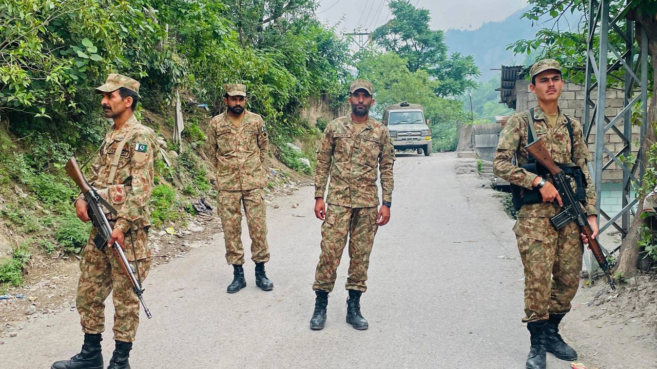 Soldiers stand guard near the site of a damaged mosque, a day after Indian strikes in Muzaffarabad, the capital of Pakistan-administered Kashmir, on May 8, 2025. Pakistan has warned it will "avenge" those killed by Indian air strikes that New Delhi said were in response to an attack in Kashmir, signalling an imminent escalation in the worst violence in decades between the nuclear-armed neighbours. (Photo by Sajjad QAYYUM / AFP)