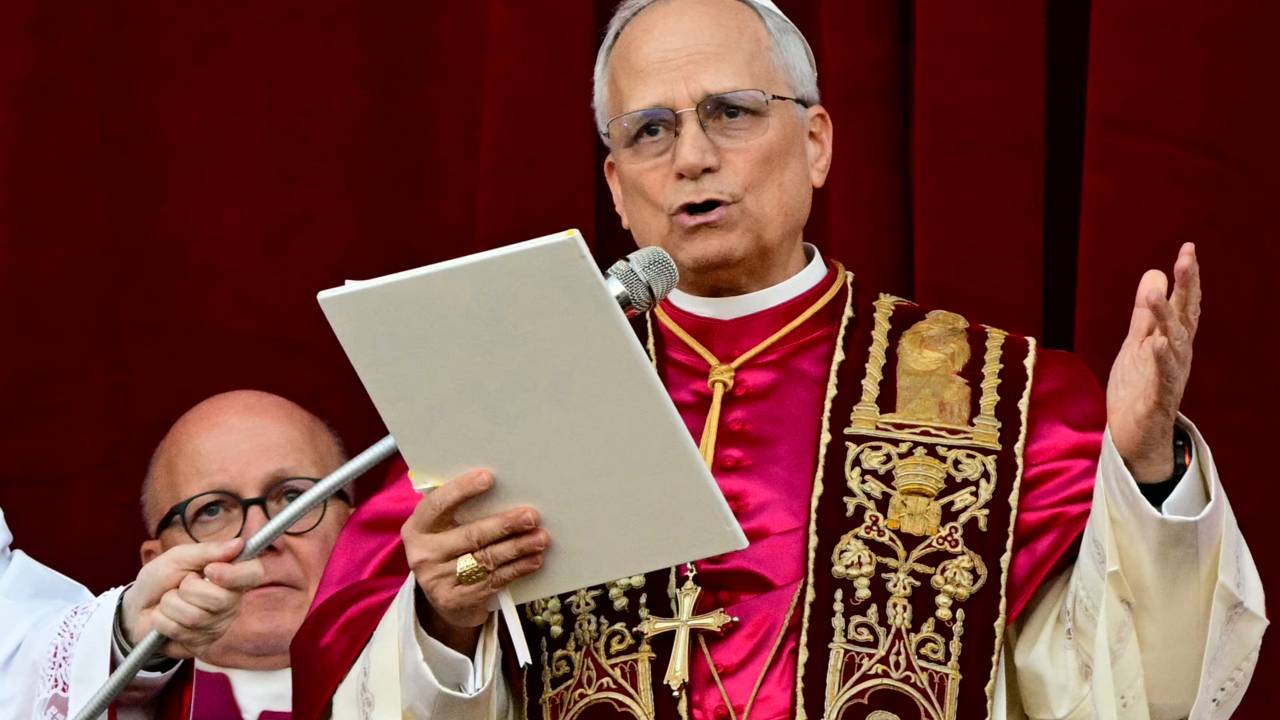 Newly elected Pope Leo XIV, Robert Prevost addresses the crowd on the main central loggia balcony of the St Peter's Basilica for the first time, after the cardinals ended the conclave, in The Vatican, on May 8, 2025. Robert Francis Prevost was on Thursday elected the first pope from the United States, the Vatican announced. A moderate who was close to Pope Francis and spent years as a missionary in Peru, he becomes the Catholic Church's 267th pontiff, taking the papal name Leo XIV. (Photo by Tiziana FABI / AFP)