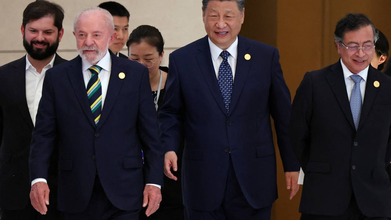 Chinese President Xi Jinping (C), Brazil President Luiz Inacio Lula da Silva (2nd L), Chile President President Gabriel Boric (L) and Colombia President Gustavo Petro (R) arrive for a group photo session before the opening ceremony of the Fourth Ministerial Meeting of the Forum of China and Community of Latin American and Caribbean States (CELAC) in Beijing on May 13, 2025. (Photo by FLORENCE LO / POOL / AFP)