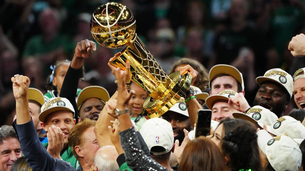 BOSTON, MA - JUNE 17: The Boston Celtics lift up the Larry O'Brien trophy after winning the 2024 NBA Championship against the Dallas Mavericks during Game 5 of the 2024 NBA Finals on June 17, 2024 at the TD Garden in Boston, Massachusetts. NOTE TO USER: User expressly acknowledges and agrees that, by downloading and or using this photograph, User is consenting to the terms and conditions of the Getty Images License Agreement. Mandatory Copyright Notice: Copyright 2024 NBAE