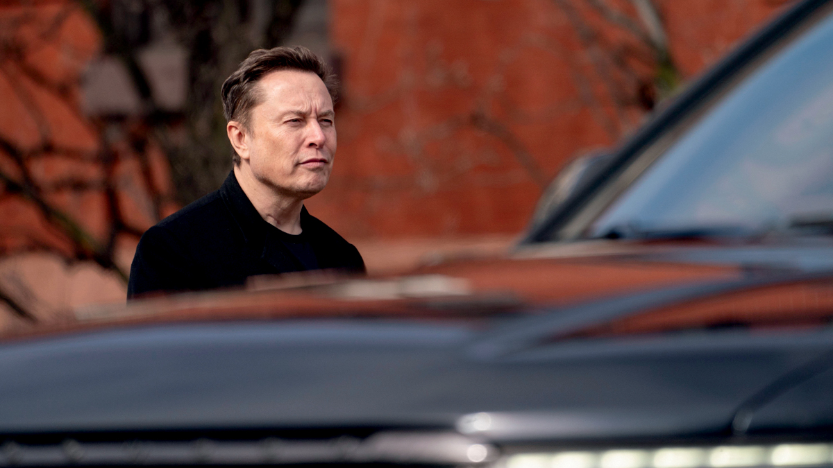 Elon Musk, chief executive officer of Tesla Inc., walks to the Eisenhower Executive Office Building (EEOB) near the White House in Washington, DC, US, on Thursday, Feb. 13, 2025. US President Donald Trump has gravitated toward the reciprocal tariff plan as a key part of his push to raise US levies overall, stating it would apply to nations who generally have a higher average tariff rate than the US, which would raise its own tariff to match them. Photographer: Stefani Reynolds/Bloomberg via Getty Images