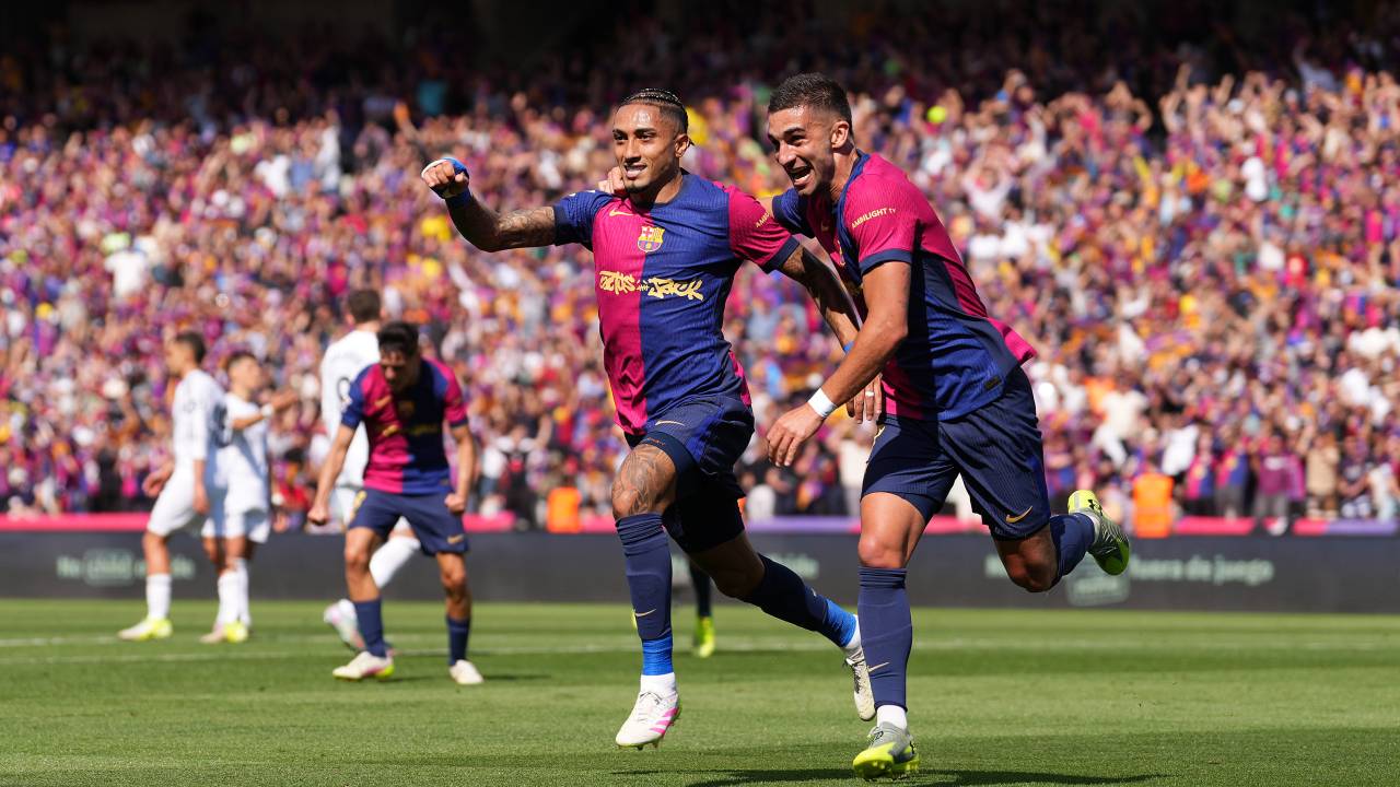 BARCELONA, SPAIN - MAY 11: Raphinha of FC Barcelona celebrates scoring his team's third goal with teammate Ferran Torres during the LaLiga match between FC Barcelona and Real Madrid CF at Estadi Olimpic Lluis Companys on May 11, 2025 in Barcelona, Spain. (Photo by Alex Caparros/Getty Images)