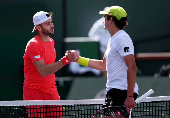 INDIAN WELLS, CALIFORNIA - MARCH 06: Joao Fonseca of Brazil shakes hands at the net after his three set victory against Jacob Fearnley of Great Britain in their first round match during the BNP Paribas Open at Indian Wells Tennis Garden on March 06, 2025 in Indian Wells, California. (Photo by Clive Brunskill/Getty Images)
