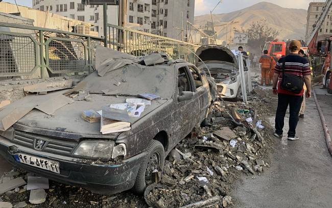 TEHRAN, IRAN - JUNE 13: A view of damaged vehicles in the Iranian capital, Tehran, following an attack, on June 13, 2025. Firefighting teams are dispatched to the area. Israeli Defense Minister Israel Katz has announced that Israel conducted strikes on Iran. (Photo by Fatemeh Bahrami/Anadolu via Getty Images)