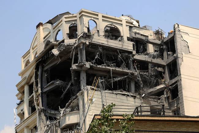 TEHRAN, IRAN - JUNE 13: Buildings in residential areas across Tehran are damaged following Israeli strikes on Iran's nuclear and military facilities on June 13, 2025. (Photo by Fatemeh Bahrami/Anadolu via Getty Images)