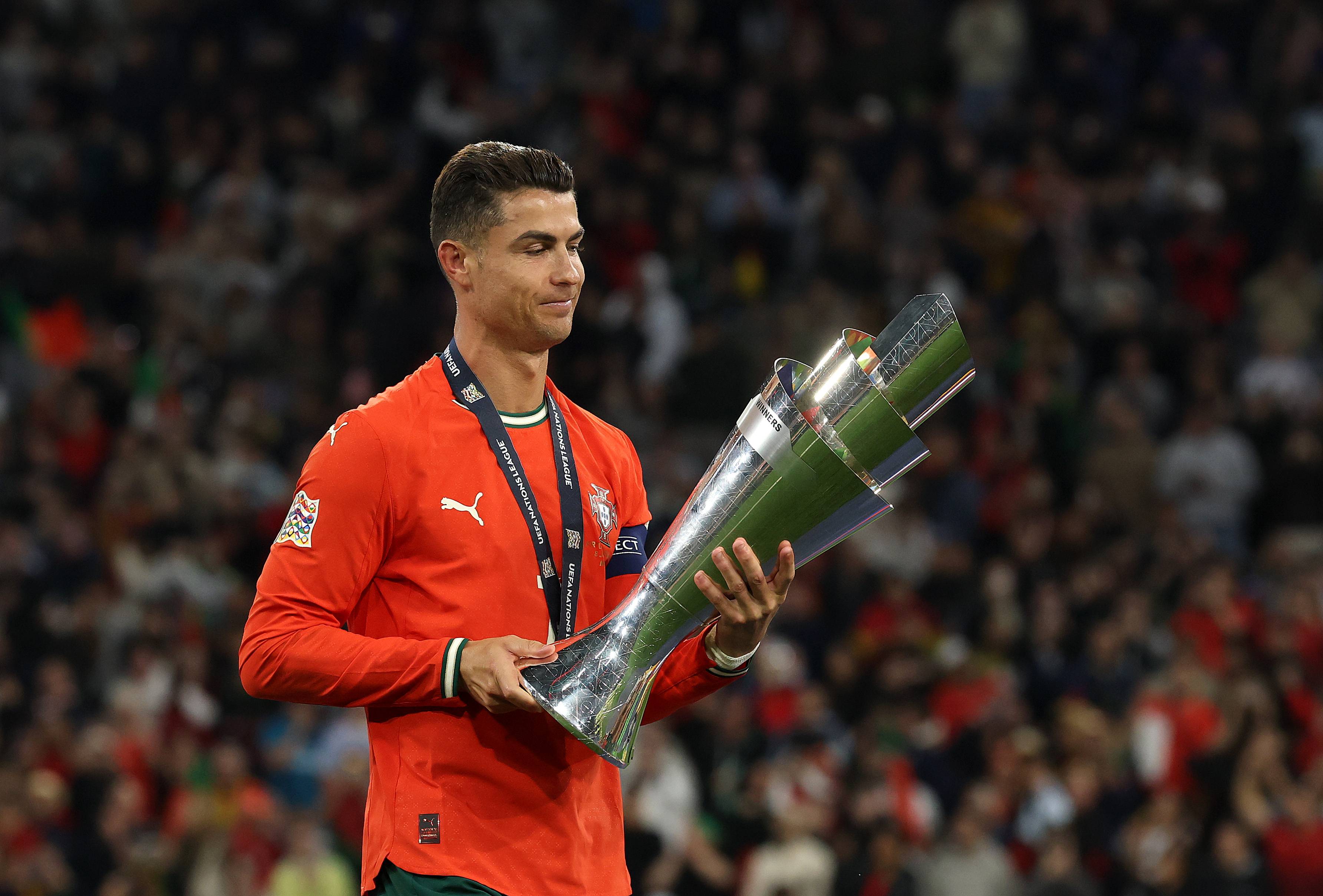 MUNICH, GERMANY - JUNE 08: Cristiano Ronaldo of Portugal holds the UEFA Nations League trophy after his team's victory in during the UEFA Nations League 2025 final match between Portugal and Spain at Munich Football Arena on June 08, 2025 in Munich, Germany. (Photo by Alexander Hassenstein/Getty Images)