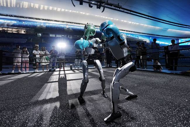 2025 World Humanoid Robot Games – Previews BEIJING, CHINA - AUGUST 13: Unitree humanoid robots participate in a training session for kickboxing projects in preparation for the 2025 World Humanoid Robot Games at the National Speed Skating Oval on August 13, 2025 in Beijing, China. The 2025 World Humanoid Robot Games (WHRG) will be held from August 14 to 17 in Beijing's National Speed Skating Oval, bringing together 280 teams from 16 countries across five continents. (Photo by Zhang Xiangyi/China News Service/VCG via Getty Images)