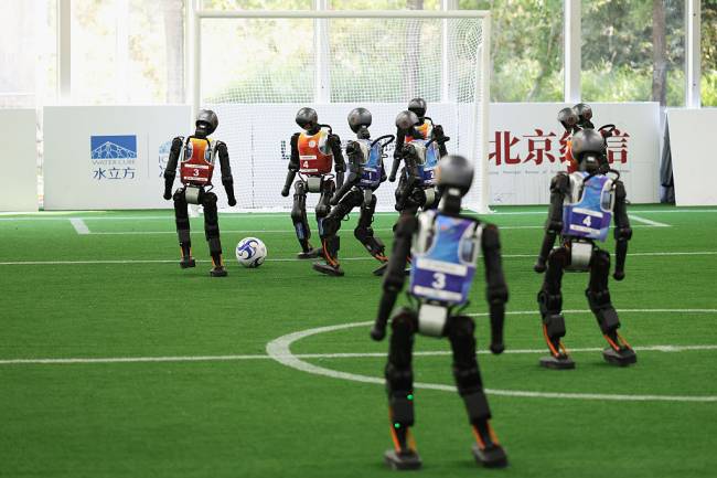2025 World Humanoid Robot Games – Previews BEIJING, CHINA - AUGUST 13: Humanoid robots compete in the 5v5 soccer preliminaries for the 2025 World Humanoid Robot Games at the National Speed Skating Oval on August 13, 2025 in Beijing, China. The 2025 World Humanoid Robot Games (WHRG) will be held from August 14 to 17 in Beijing's National Speed Skating Oval, bringing together 280 teams from 16 countries across five continents. (Photo by Lintao Zhang/Getty Images)