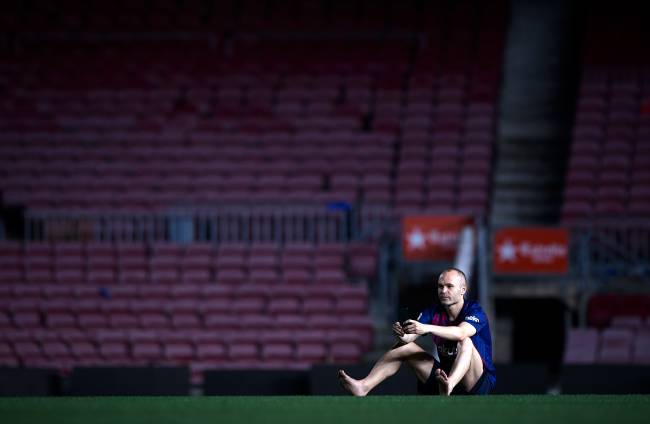 BARCELONA, SPAIN - MAY 20: Andres Iniesta of FC Barcelona sits on the pitch at the end the La Liga match between Barcelona and Real Sociedad at Camp Nou on May 20, 2018 in Barcelona, Spain. (Photo by Quality Sport Images/Getty Images)