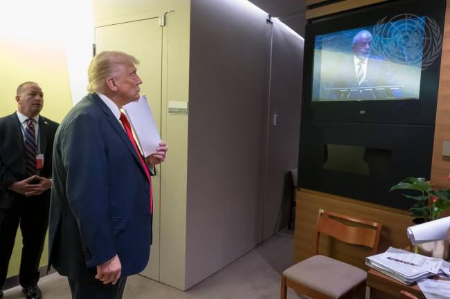 President of United States of America Addresses 80th Session of General Assembly Debate Donald Trump, President of the United States of America, waits behind the General Assembly Hall to address the general debate of the General Assembly’s eightieth session. On the screen is Luiz Inácio Lula da Silva, President of the Federative Republic of Brazil.