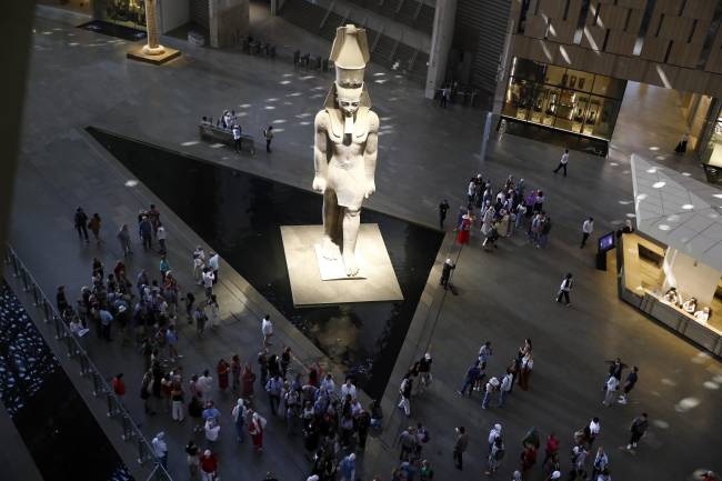 Grand Egyptian museum showcases Egypt’s history from Prehistoric to Pharaonic era GIZA, EGYPT - OCTOBER 14: An aerial view of as tourists visit the Grand Egyptian Museum, located near the Pyramids of Giza, in Giza, Egypt, on October 14, 2025. The museum displays thousands of artifacts from prehistoric, Pharaonic, and Roman eras, including the golden treasures of King Tutankhamun, whose tomb was discovered in 1922. The site attracts thousands of visitors each year with its twelve exhibition halls, gardens, and cultural spaces. (Photo by Fareed Kotb/Anadolu via Getty Images)