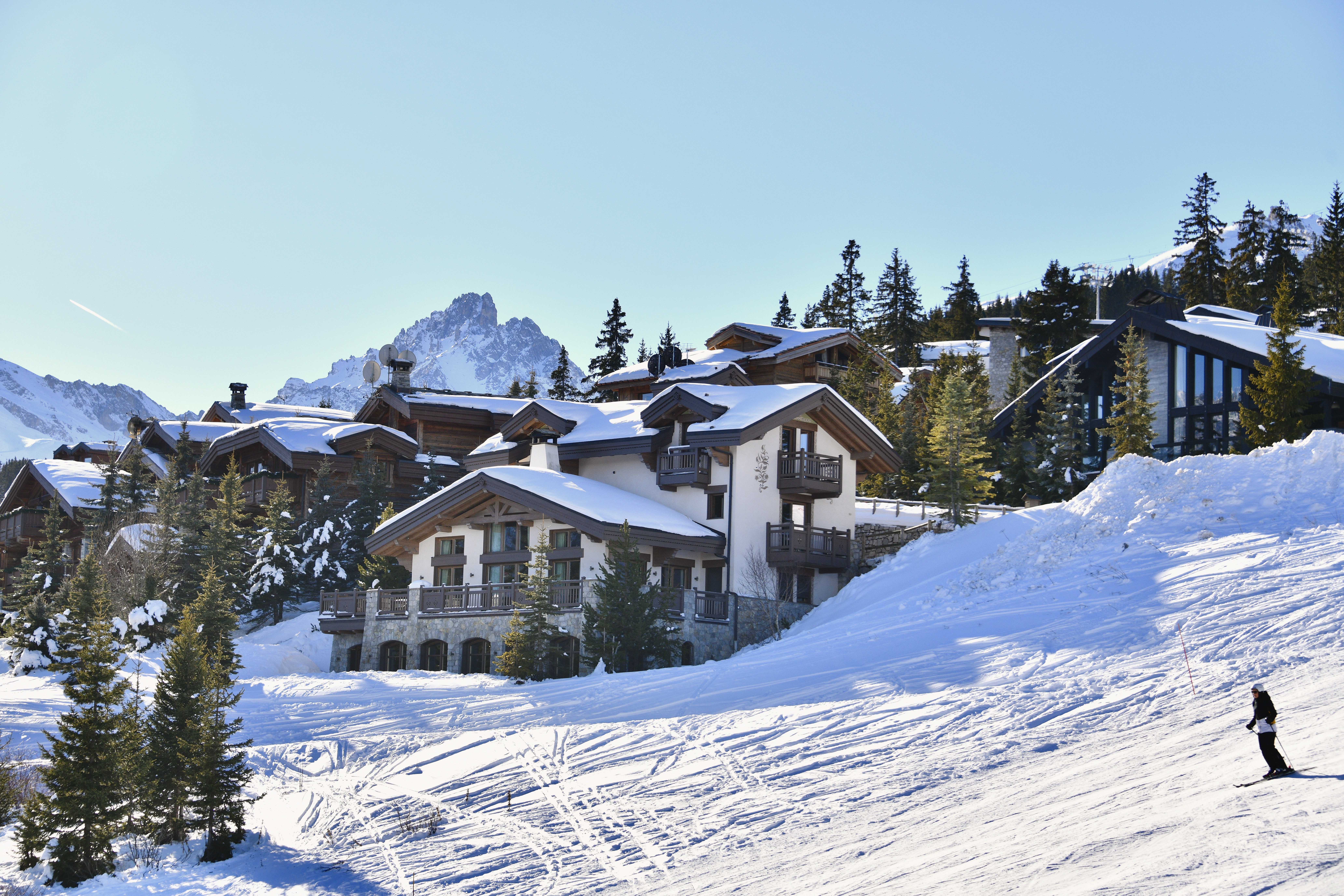 Chalets on the slopes of  famous Courchevel ski resort by winter