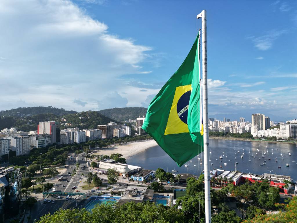 Brazilian National Flag with Rio in the background